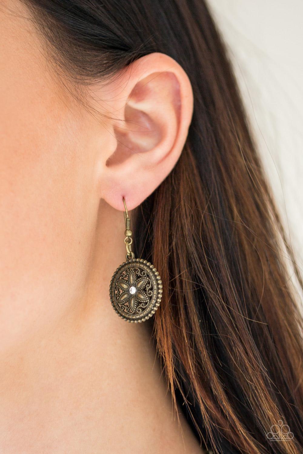 Paparazzi Accessories Written In The STAR LILLIES - Brass Dotted with glittery rhinestone centers, floral brass frames gradually increase in size as they link below the collar for a whimsical look. Features an adjustable clasp closure. Jewelry