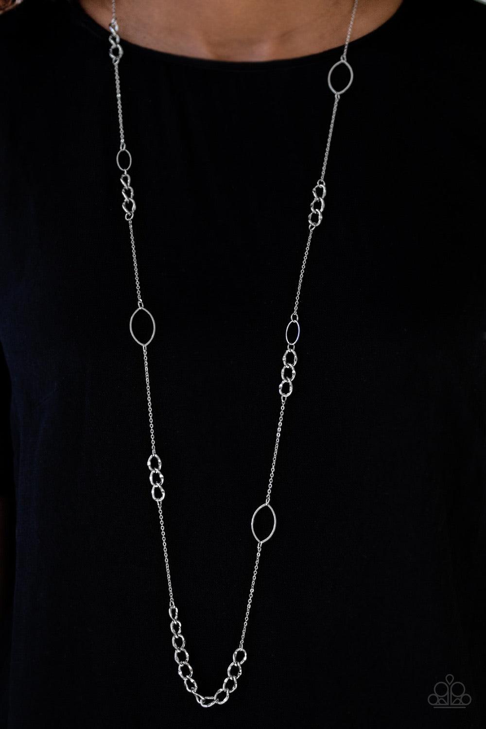 Paparazzi Accessories Metro Minimalist - Silver Marquise-shaped frames and sections of faceted chain links trickle along a dainty silver chain for a bold, minimalist inspired look. Features an adjustable clasp closure. Jewelry