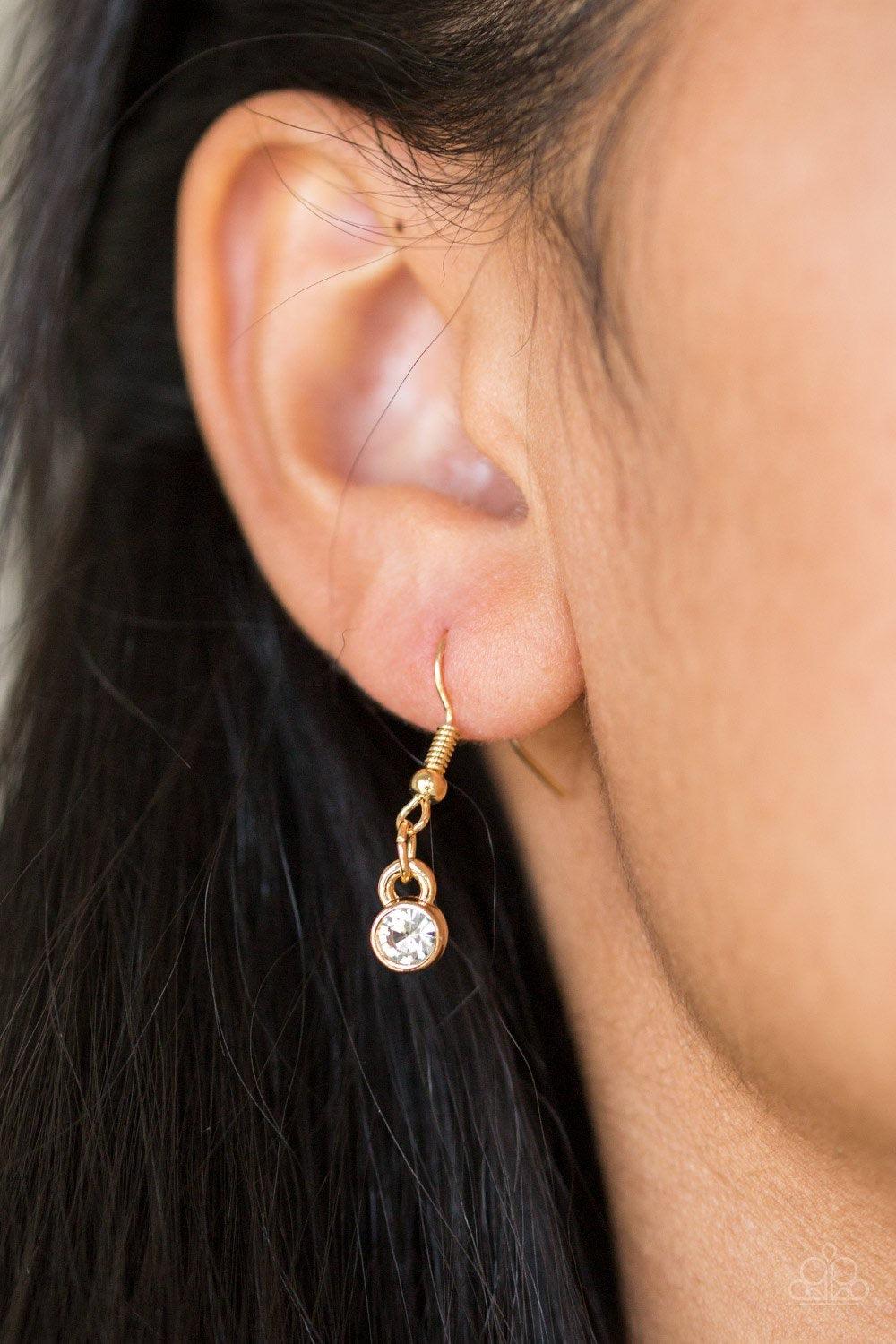 Paparazzi Accessories Whatever Floats Your Yacht - Gold Encrusted in glassy white rhinestones, studded gold bars braid into a bowing pendant below the collar for a refined fashion. Features an adjustable clasp closure. Jewelry