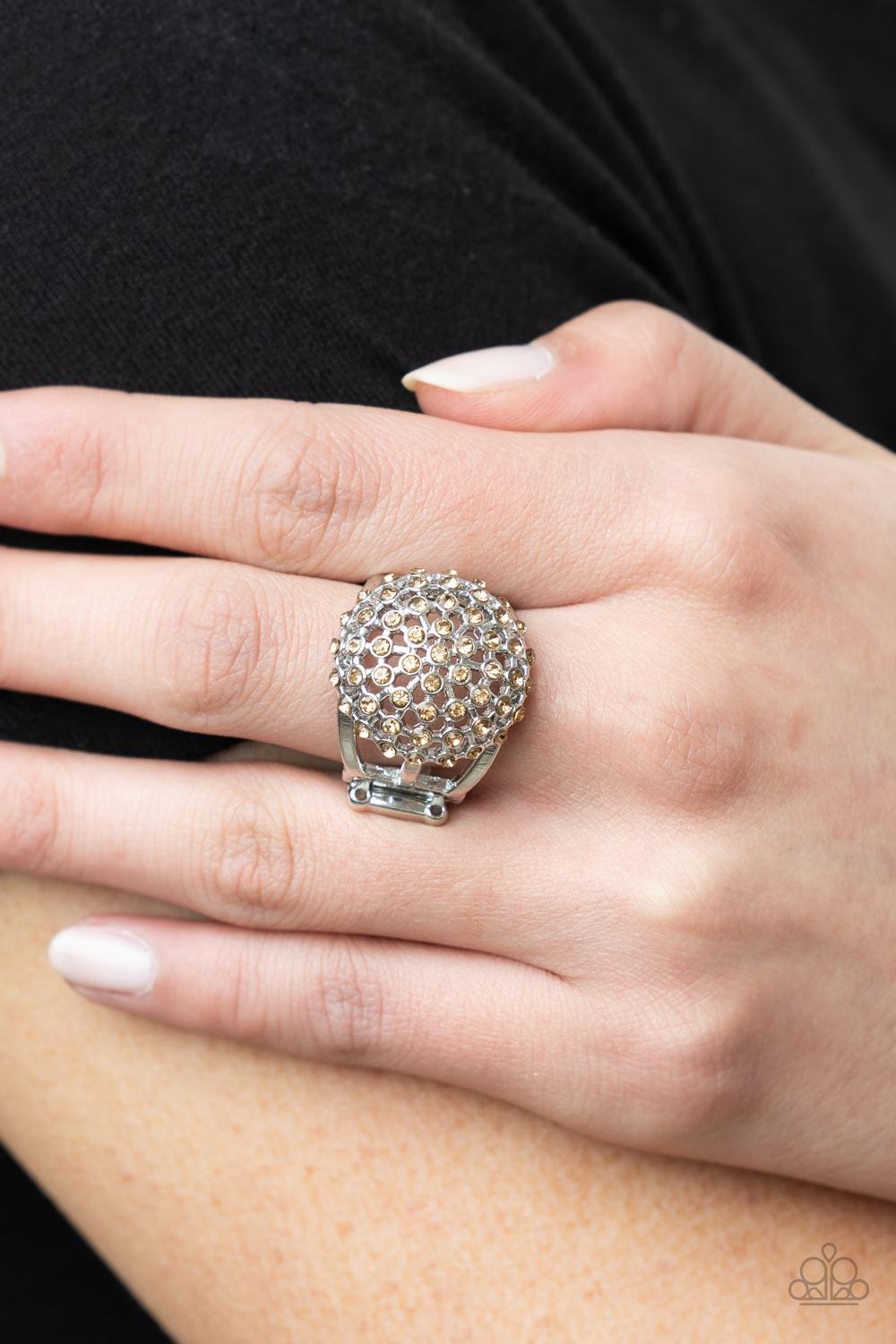 Paparazzi Accessories Magically Moroccan - Brown Glittering dainty light topaz rhinestones encased in a silver starburst frame create a magical centerpiece atop the finger. Features a stretchy band for a flexible fit. Sold as one individual ring. Body Jew