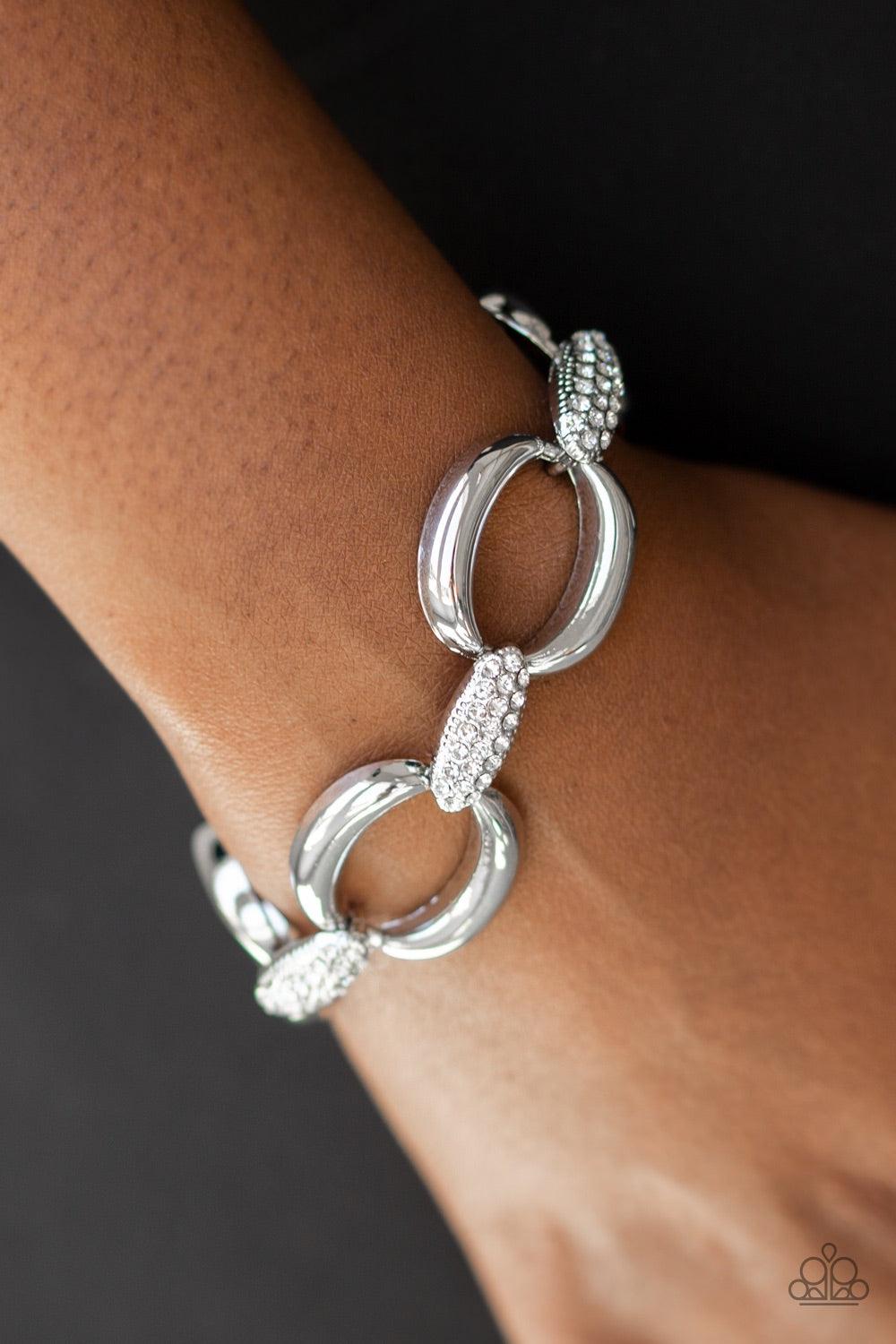 Paparazzi Accessories Don’t Forget Who’s Boss - White Bold silver links join with white rhinestone encrusted frames around the wrist for a fierce look. Features an adjustable clasp closure. Jewelry