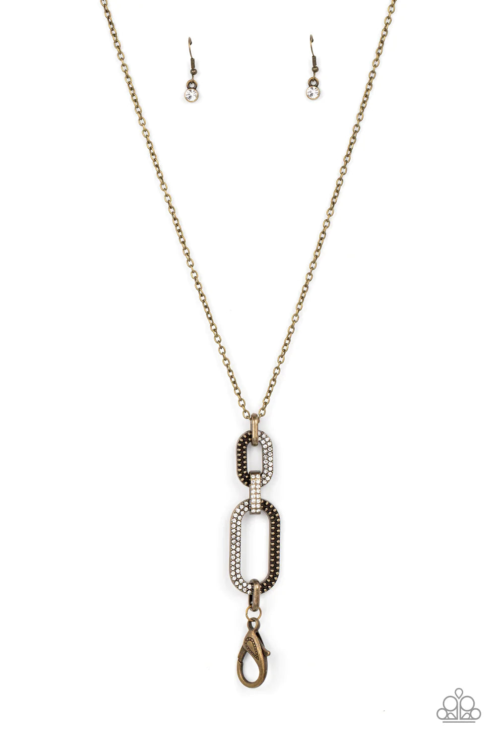 Paparazzi Accessories OVAL-Statement of the Year - Brass *Lanyard Featuring half studs and half white rhinestones, two sparkly brass oval frames link with rustic brass fittings at the bottom of a lengthened brass chain for a gritty-glamorous look. A lobst