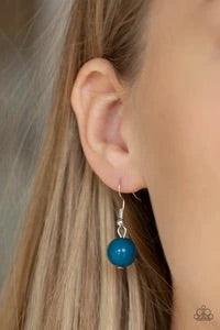 Paparazzi Accessories Cache Me Out - Blue A collection of glassy and polished blue beads give way to layers of mismatched silver chain for a whimsical look. Features an adjustable clasp closure. Sold as one individual necklace. Includes one pair of matchi
