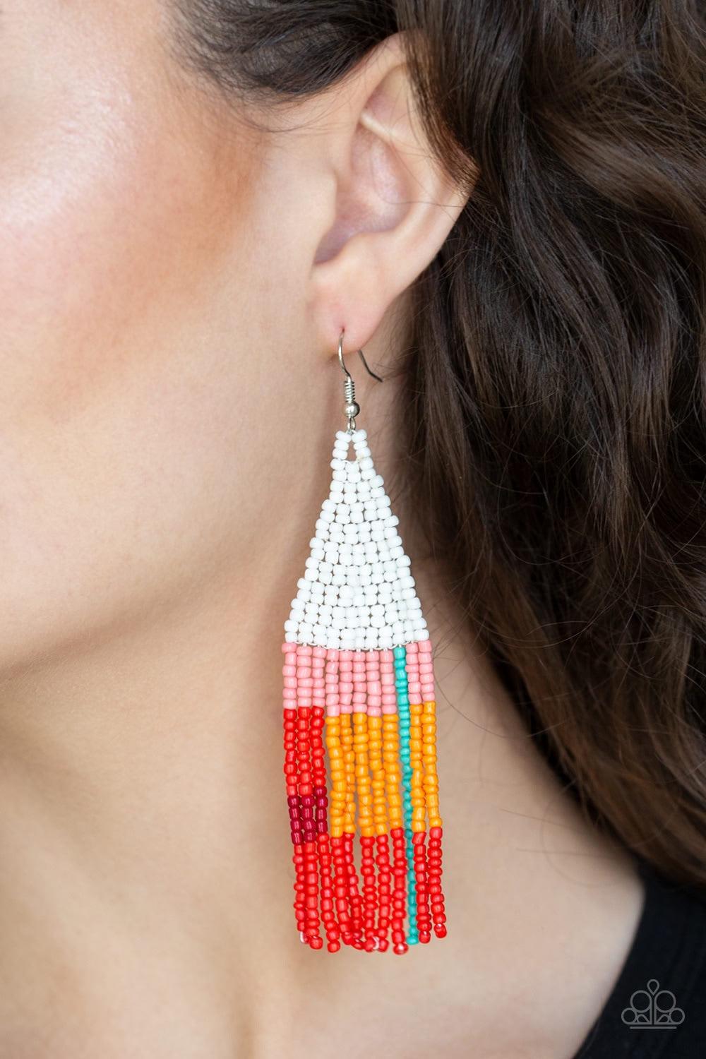 Paparazzi Accessories Beaded Boho - White Featuring white, pink, blue, orange, and red seed beads, dainty beaded tassels swing from a beaded triangular frame for a colorful tribal look. Earring attaches to a standard fishhook fitting. Jewelry