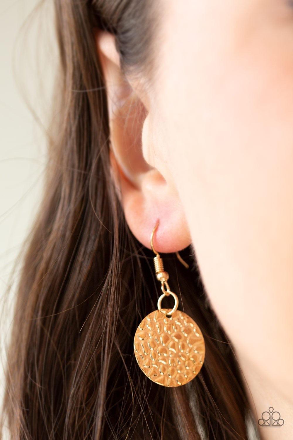 Paparazzi Accessories Work Every CHIME ~Gold Rippling with glistening textures, glistening gold discs dance along two shimmery gold chains, creating an edgy fringe below the collar. Features an adjustable clasp closure. Sold as one individual necklace. In