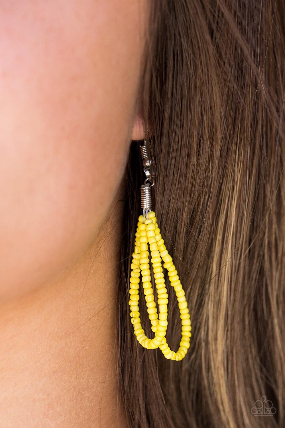 Paparazzi Accessories A Standing Ovation - Yellow Countless strands of sunny yellow seed beads are twisted and knotted together to create an unforgettable statement piece. Features an adjustable clasp closure. Jewelry
