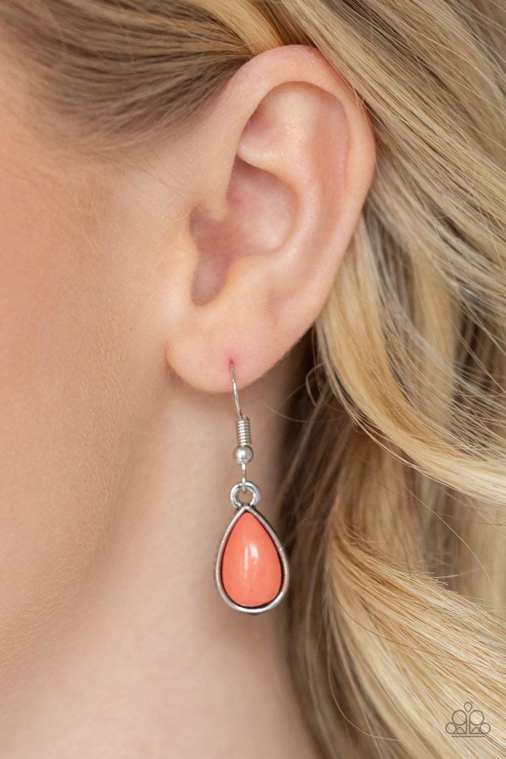 Paparazzi Accessories Jaw-Dropping Diva - Orange Encased in sleek silver frames, Living Coral teardrop beads drip from the bottom of a shimmery silver chain, creating a refreshing fringe below the collar. Features an adjustable clasp closure. Sold as one