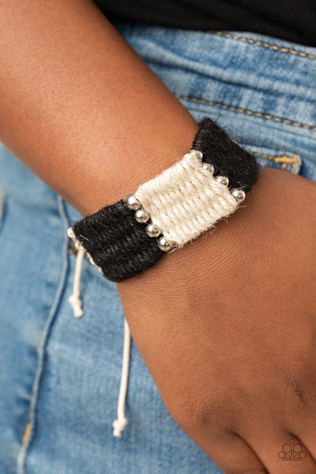 Paparazzi Accessories High Tides - Black Infused with classic silver beads, white and black twine-like cording knots and weaves around the wrist for a colorful beach inspired look. Features an adjustable sliding knot closure. Jewelry