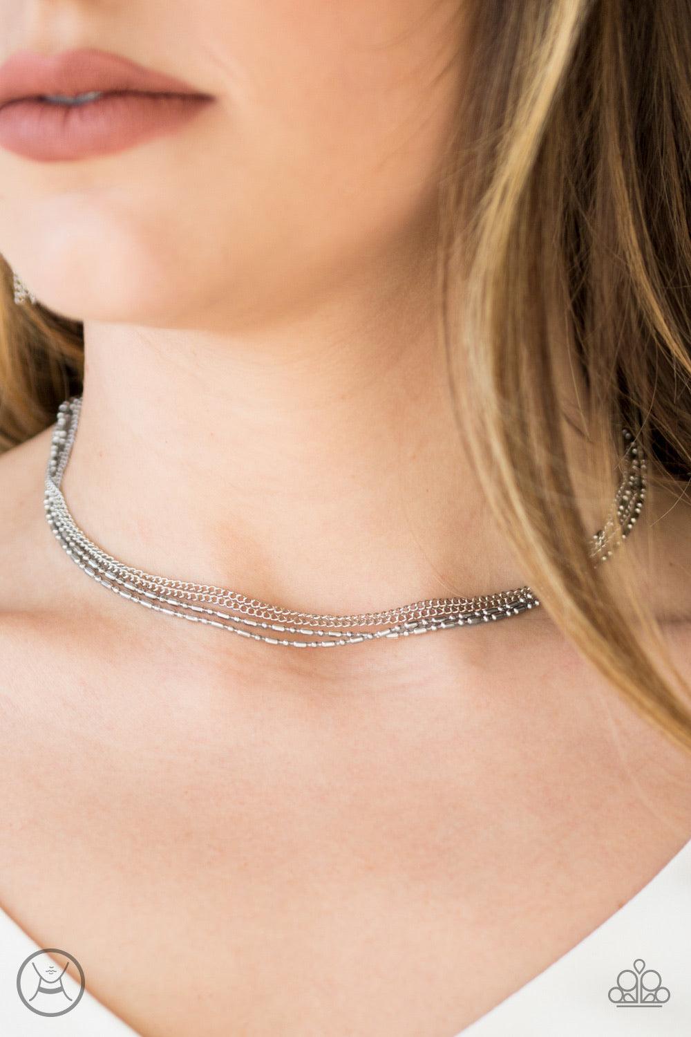 Paparazzi Accessories Metro Mayhem - Silver Mismatched dainty silver chains link around the neck for a sleek industrial look. Features an adjustable clasp closure. Sold as one individual choker necklace. Includes one pair of matching earrings. Jewelry