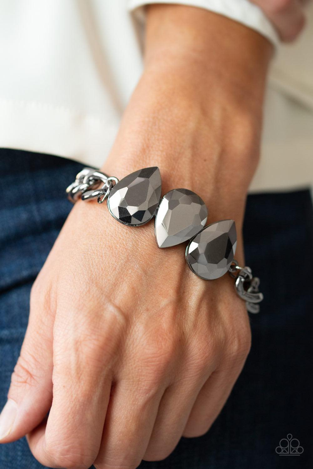 Paparazzi Accessories Bring Your Own Bling - Black Three oversized hematite teardrop gems join at the center of a dramatic gunmetal chain, creating a jaw-dropping display across the wrist. Features an adjustable clasp closure. Jewelry