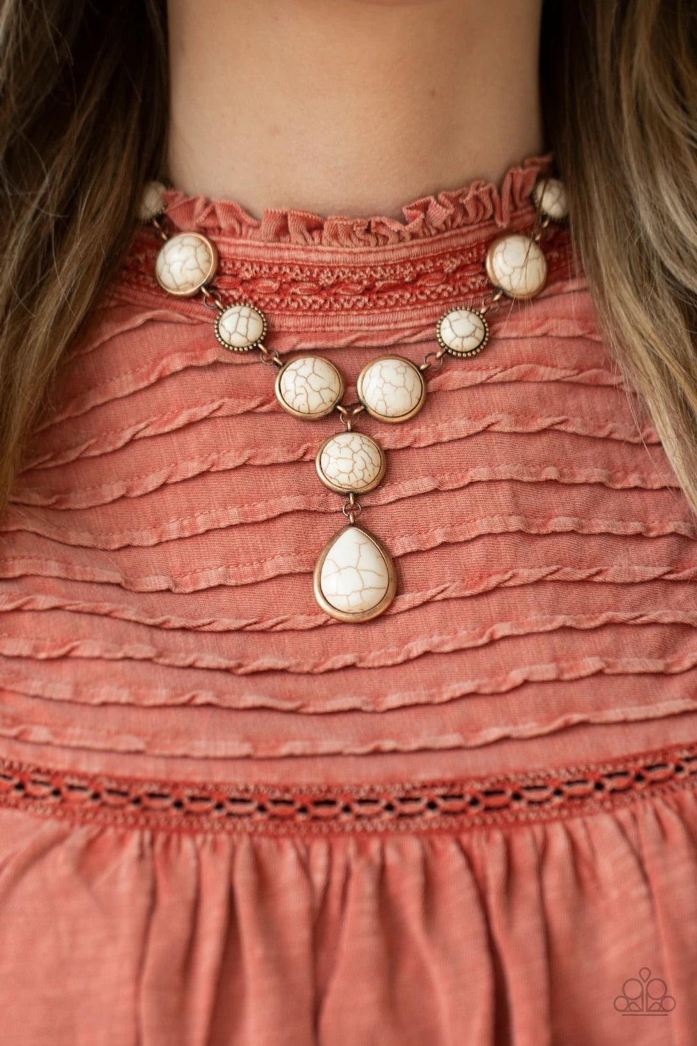 Paparazzi Accessories Terrestrial Trailblazer - Copper Featuring studded and plain copper frames, small and large white stones delicately alternate below the collar. A refreshing white stone teardrop frame swings from the bottom of a matching stone frame,