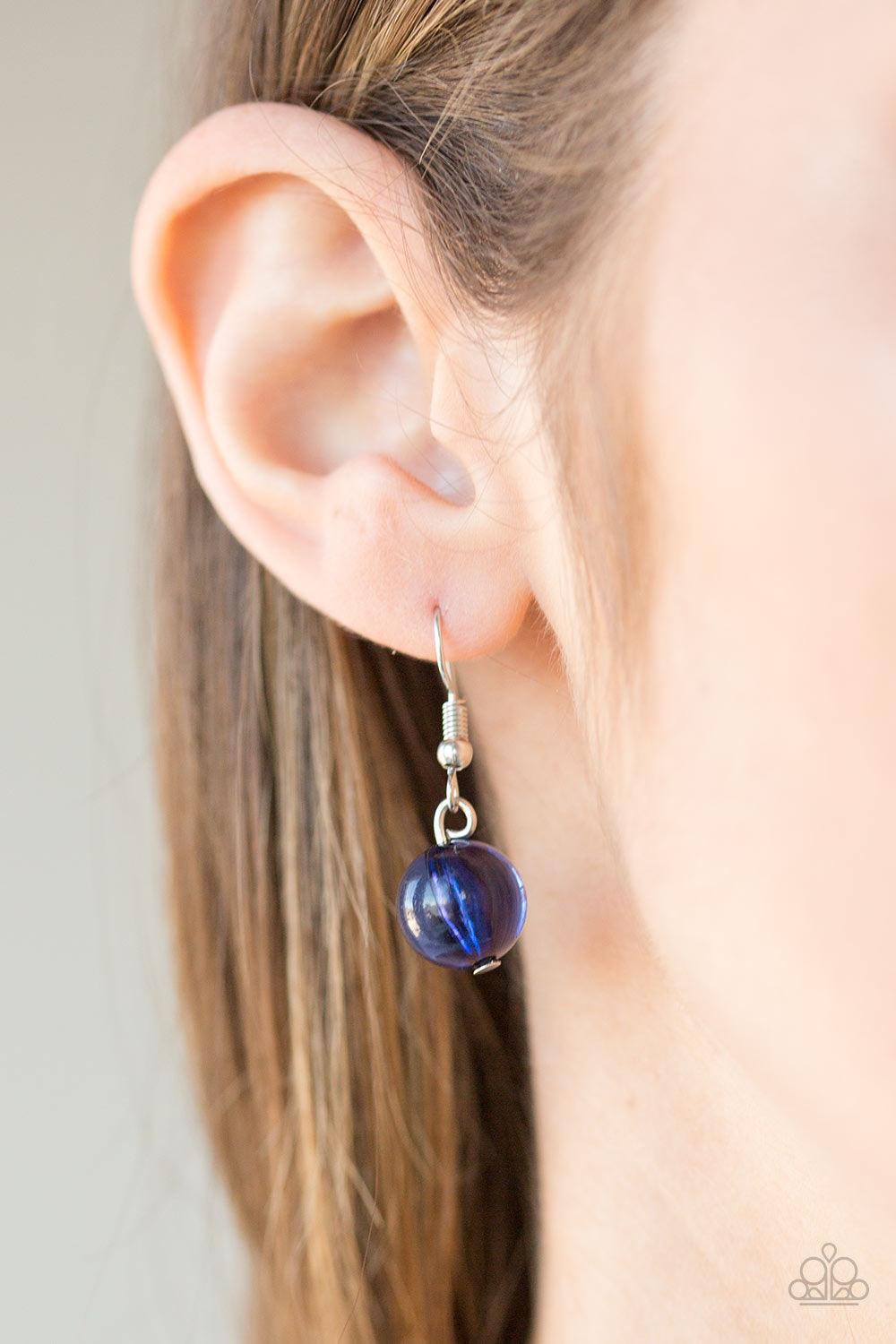 Paparazzi Accessories Mountain Mosaic - Blue Glassy blue, polished blue, and classic silver chains swing from the bottom of a shimmery silver chain. Infused with large silver hoops, bits of tranquil blue rock beading trickle between the beaded accent, cre