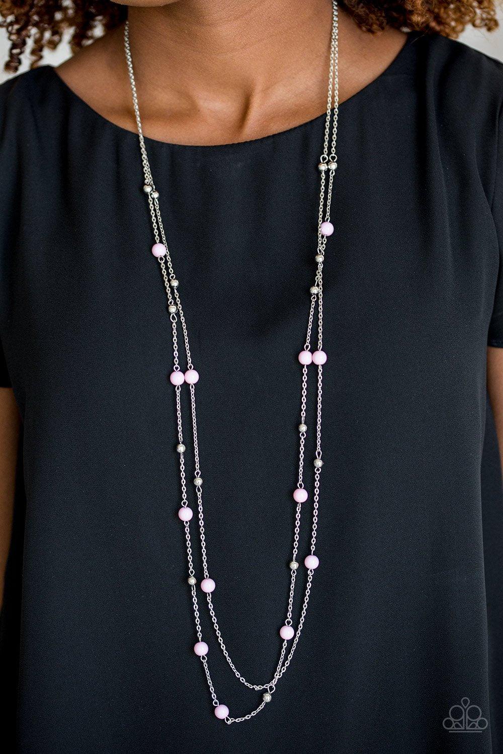 Paparazzi Accessories Beach Party Pageant - Pink Pretty pink and dainty silver beads trickle along two shimmery silver chains, creating colorful layers down the chest. Features an adjustable clasp closure. Sold as one individual necklace. Includes one pai