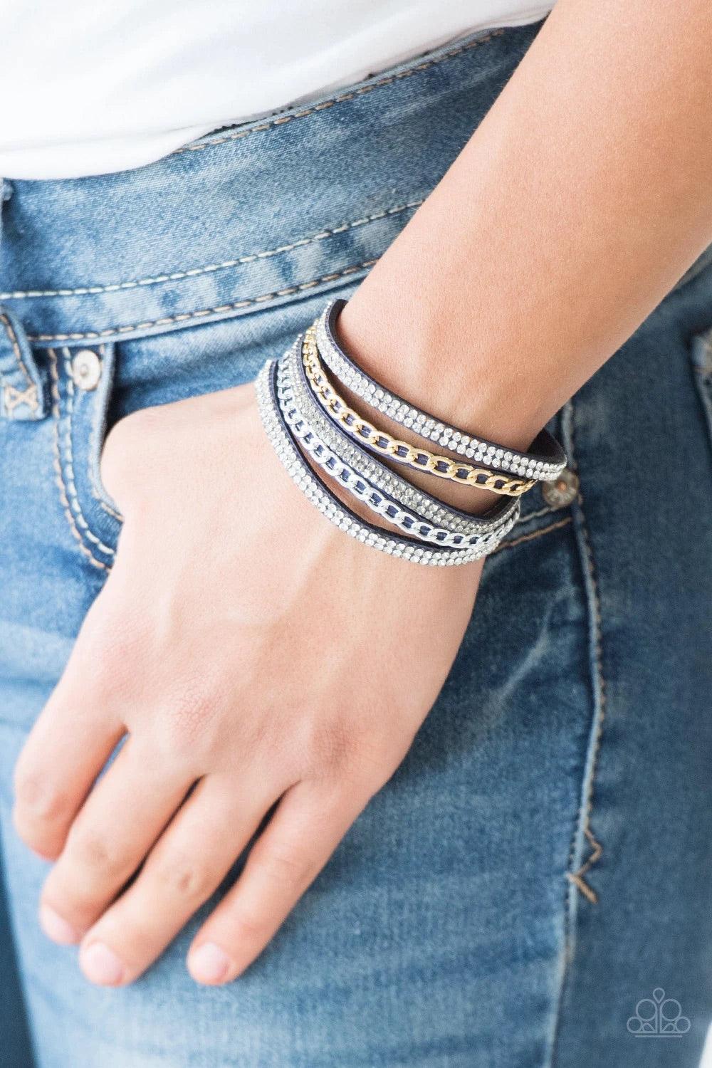 Paparazzi Accessories Fashion Fiend - Blue Glassy white and smoky rhinestones are encrusted along strands of blue suede. Glistening silver and gold chains are added to the bands, adding edgy industrial shimmer to the sassy palette. Features an adjustable