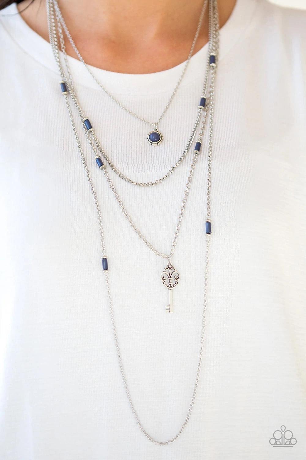 Paparazzi Accessories Key Keynote - Blue Featuring shiny blue and dainty silver accents, a blue beaded pendant gives way to a shimmery silver key for a whimsically layered look. Features an adjustable clasp closure. Sold as one individual necklace. Includ