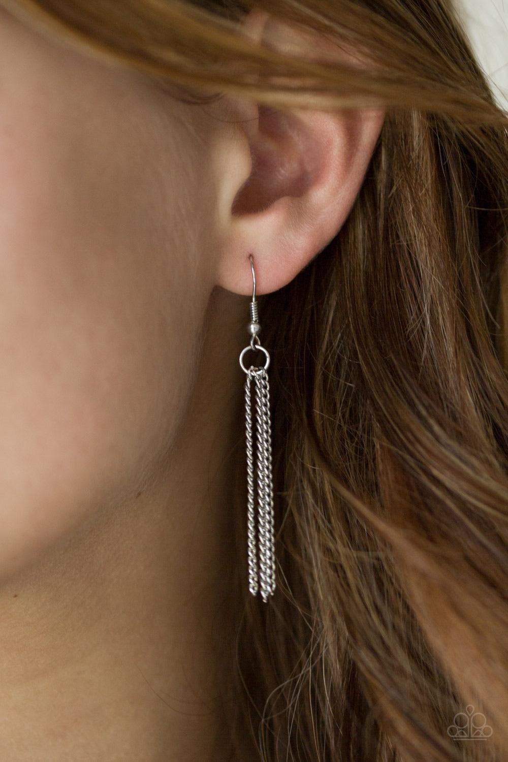 Paparazzi Accessories The Royal Coronation - Brown An oversized golden teardrop gem swings from the top of a glistening silver teardrop frame. The dramatic pendant swings from the bottom of an elegantly elongated silver chain for a regal finish. Features