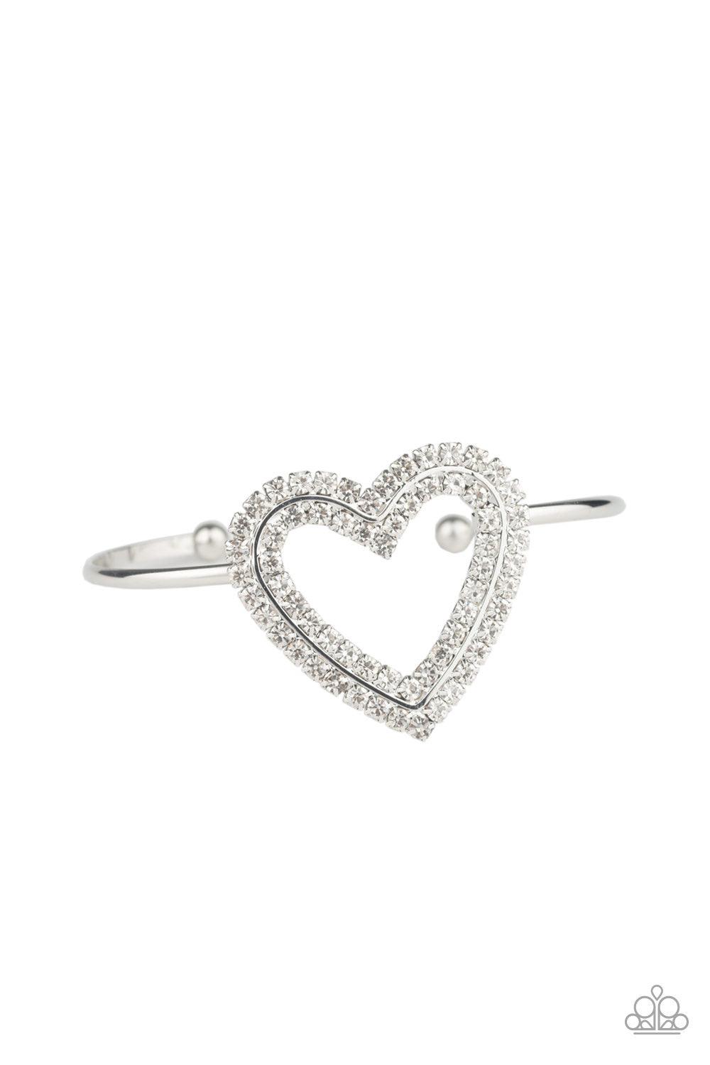 Paparazzi Accessories Heart Opener - White Two rows of glittery white rhinestones stack into a sparkling heart atop a dainty silver cuff for a charming look. Jewelry