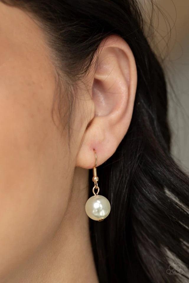 Paparazzi Accessories Soon To Be Mrs - Gold Varying in size, bubbly white pearls swing from the bottom of a classic strand of pearls, creating a refined fringe below the collar. Features an adjustable clasp closure. Sold as one individual necklace. Includ