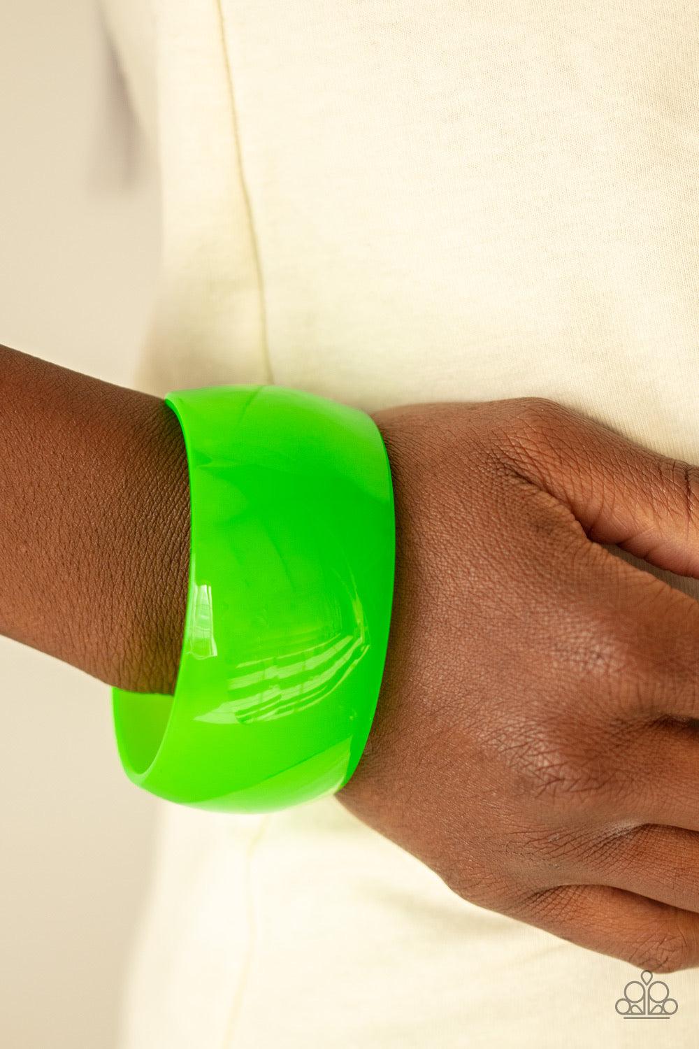 Paparazzi Accessories Fluent In Flamboyance - Green A neon green acrylic cuff curls around the wrist for a colorfully retro look. Jewelry