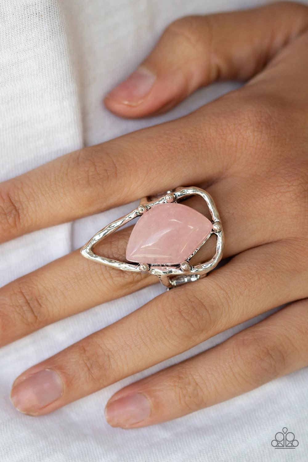 Paparazzi Accessories Get The Point - Pink An abstract pink stone is nestled inside a hammered silver triangle, creating an artisan inspired frame atop the finger. Features a stretchy band for a flexible fit. Jewelry