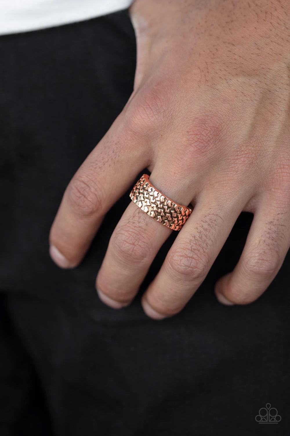 Paparazzi Accessories All Wheel Drive - Copper Embossed in a tactile tread-like pattern, a glistening copper band curls around the finger for an edgy look. Features a stretchy band for a flexible fit. Sold as one individual ring. Jewelry
