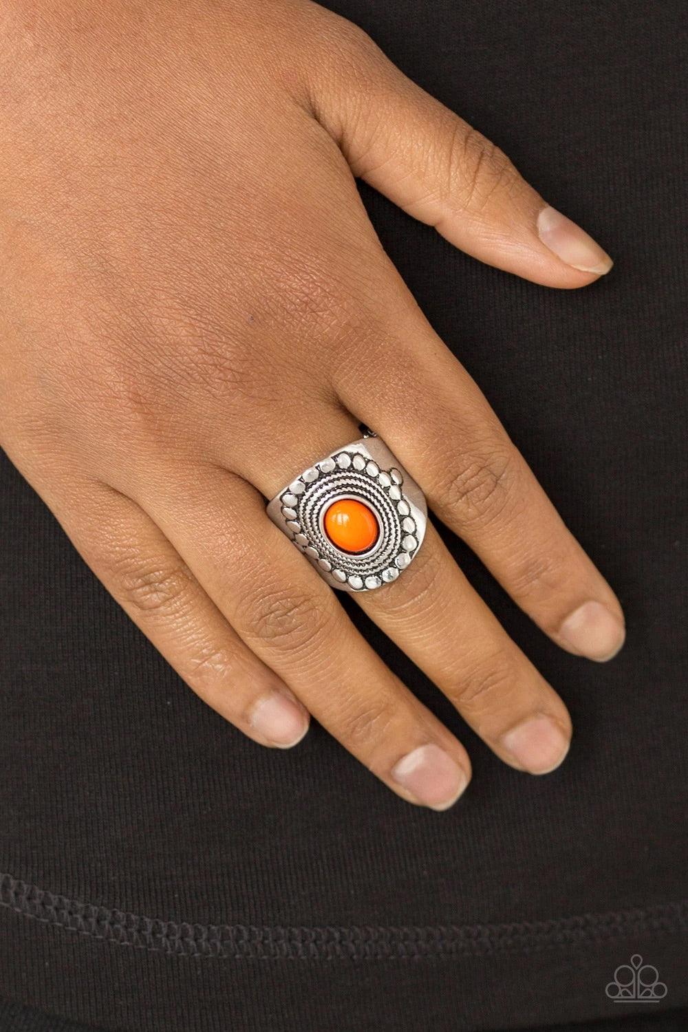 Paparazzi Accessories Zen To One - Orange A vivacious orange bead is pressed into the center of a thick band radiating with dotted and rope-like patterns for a seasonal look. Features a stretchy band for a flexible fit. Jewelry