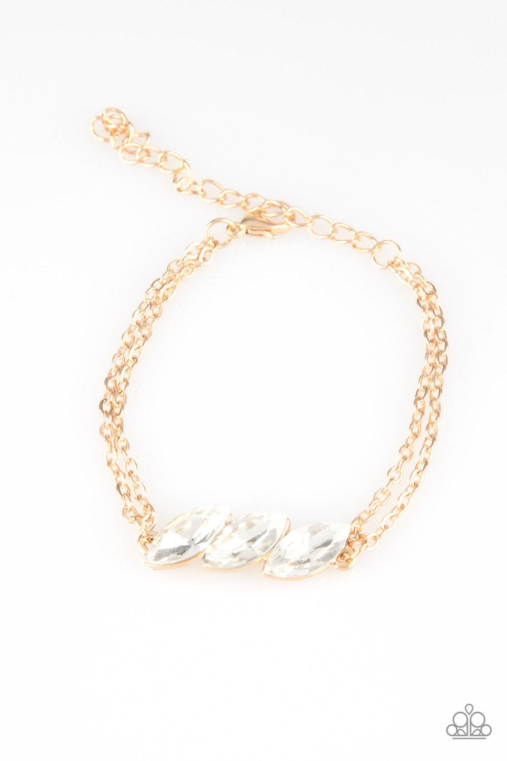 Paparazzi Accessories Pretty Priceless - Gold Featuring regal marquise-cuts, a trio of glittery white rhinestones join across the center of the wrist for a timeless look. Features an adjustable clasp closure. Sold as one individual bracelet. Jewelry