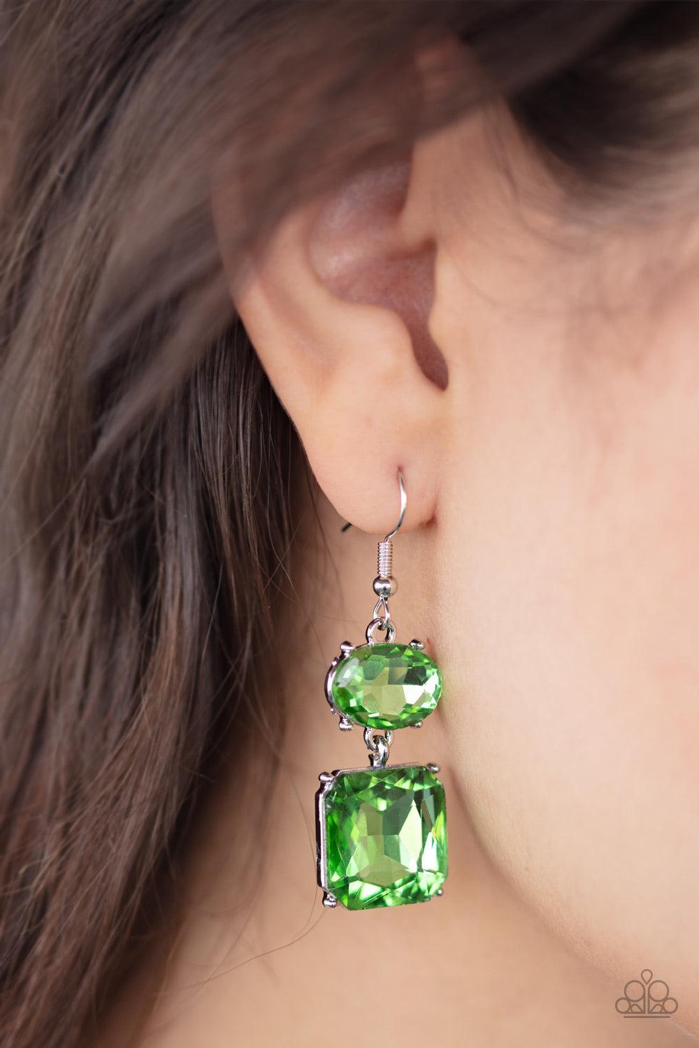 Paparazzi Accessories All Ice On Me - Green Encased in classic silver frames, a glittery oval and square green gem link into a glamorous lure. Earring attaches to a standard fishhook fitting. Jewelry