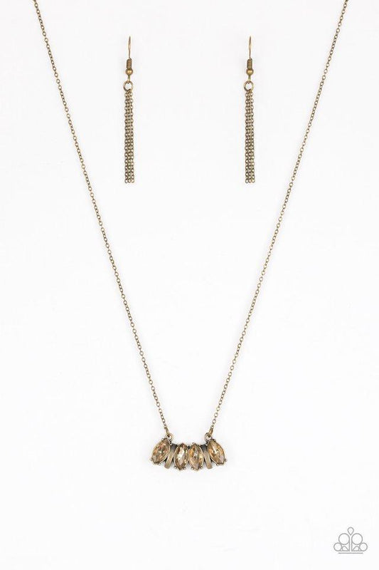 Paparazzi Accessories Deco Decadence - Brass Featuring elegant marquise style cuts, golden topaz rhinestones join with brass accents below the collar, creating a dainty pendant. Features an adjustable clasp closure. Jewelry