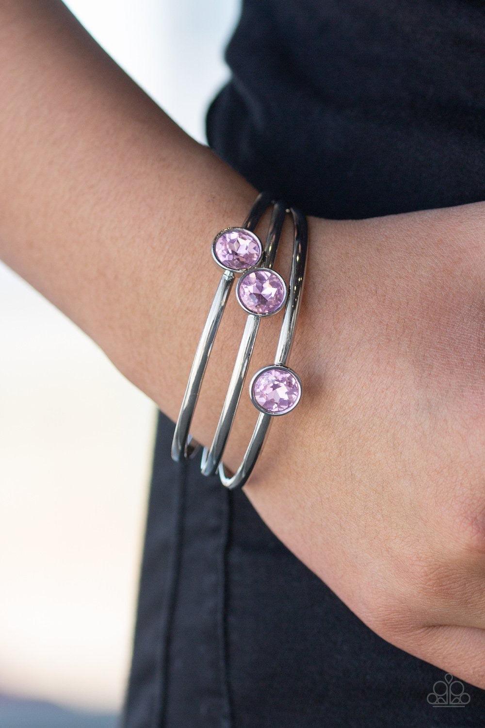 Paparazzi Accessories Be All You Can BEDAZZLE - Pink Encased in sleek silver frames, dazzling pink gems sit atop thick silver bangles for a refined flair. Sold as one set of three bracelets. Jewelry