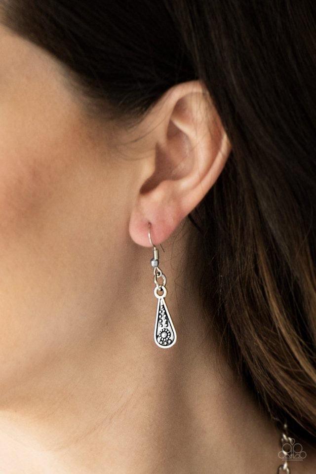 Paparazzi Accessories Go STEER-Crazy - Multi Gradually decreasing in size down the chest, decorative silver and brass crescent plates connect into a bold pendant. Dotted in dainty studs, teardrop silver frames swing from the bottom of the tribal inspired