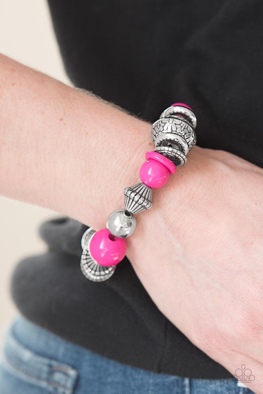 Paparazzi Accessories Seize The Season - Pink Embossed in a whimsical floral pattern, chunky silver beads, mismatched silver accents, and vivacious pink beads are threaded along an elastic stretchy band for a seasonal look. Jewelry