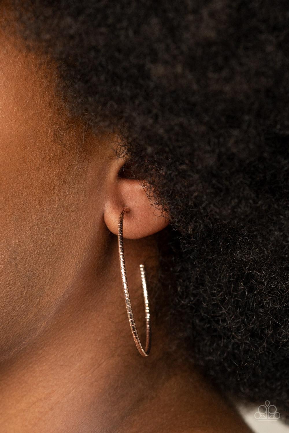 Paparazzi Accessories Inclined To Entwine - Rose Gold Etched in shimmery texture, a dainty rose gold hoop curls around the earring for a refined flair. Earring attaches to a standard post fitting. Hoop measures approximately 2" in diameter. Sold as one pa