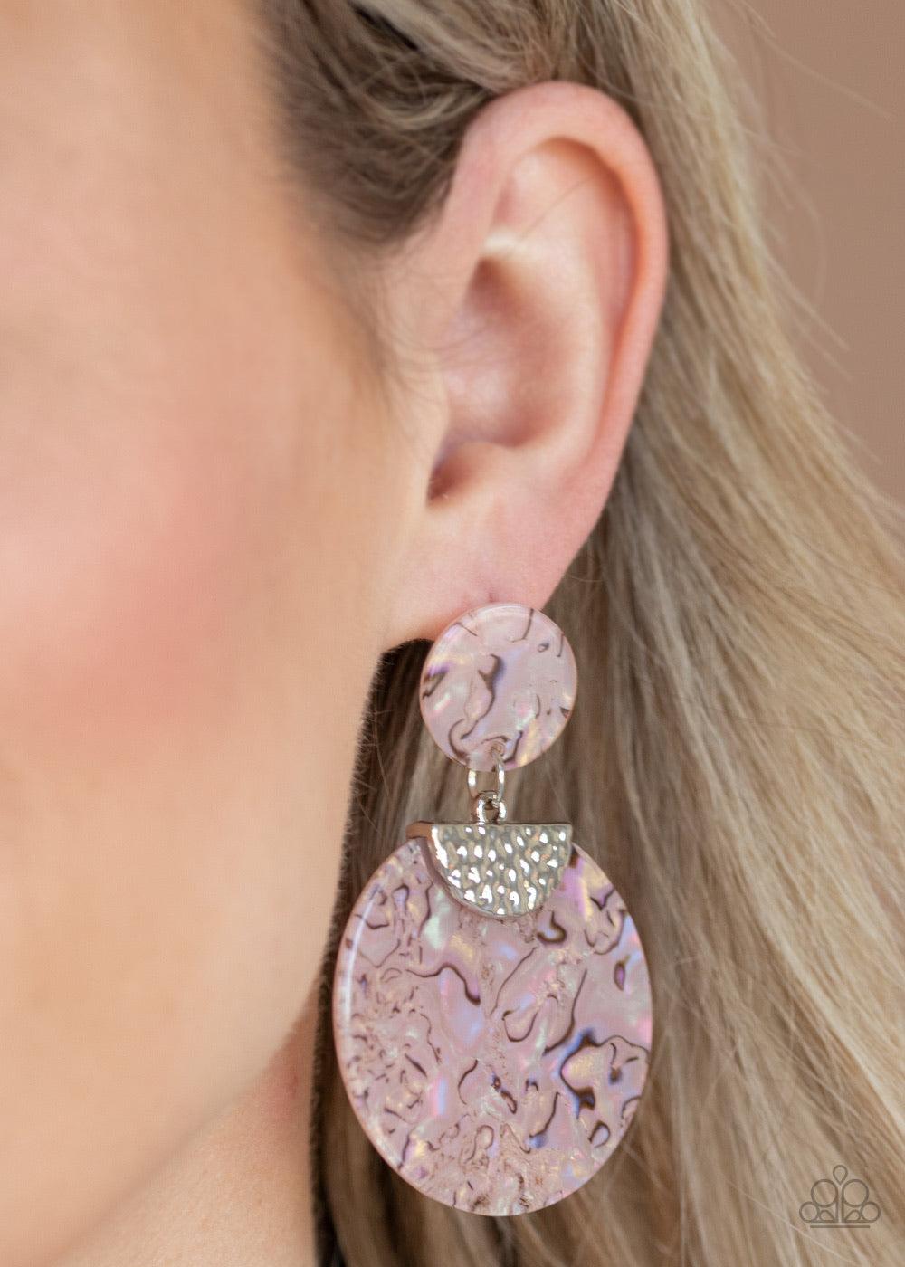 Paparazzi Accessories Really Retro-Politan - Pink A hammered silver fitting pinches an iridescent acrylic circle swirling with dizzying pink accents. The colorful frame links to the bottom of a dainty pink acrylic circle, coalescing into a retro lure. Ear