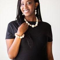 Paparazzi Accessories Rockin Rockefeller - Gold Dramatic white pearls and shiny gold beads are threaded along an elastic stretchy band around the wrist. Glistening gold accents are sprinkled between the classic beads, adding depth and shimmer to the bubbl