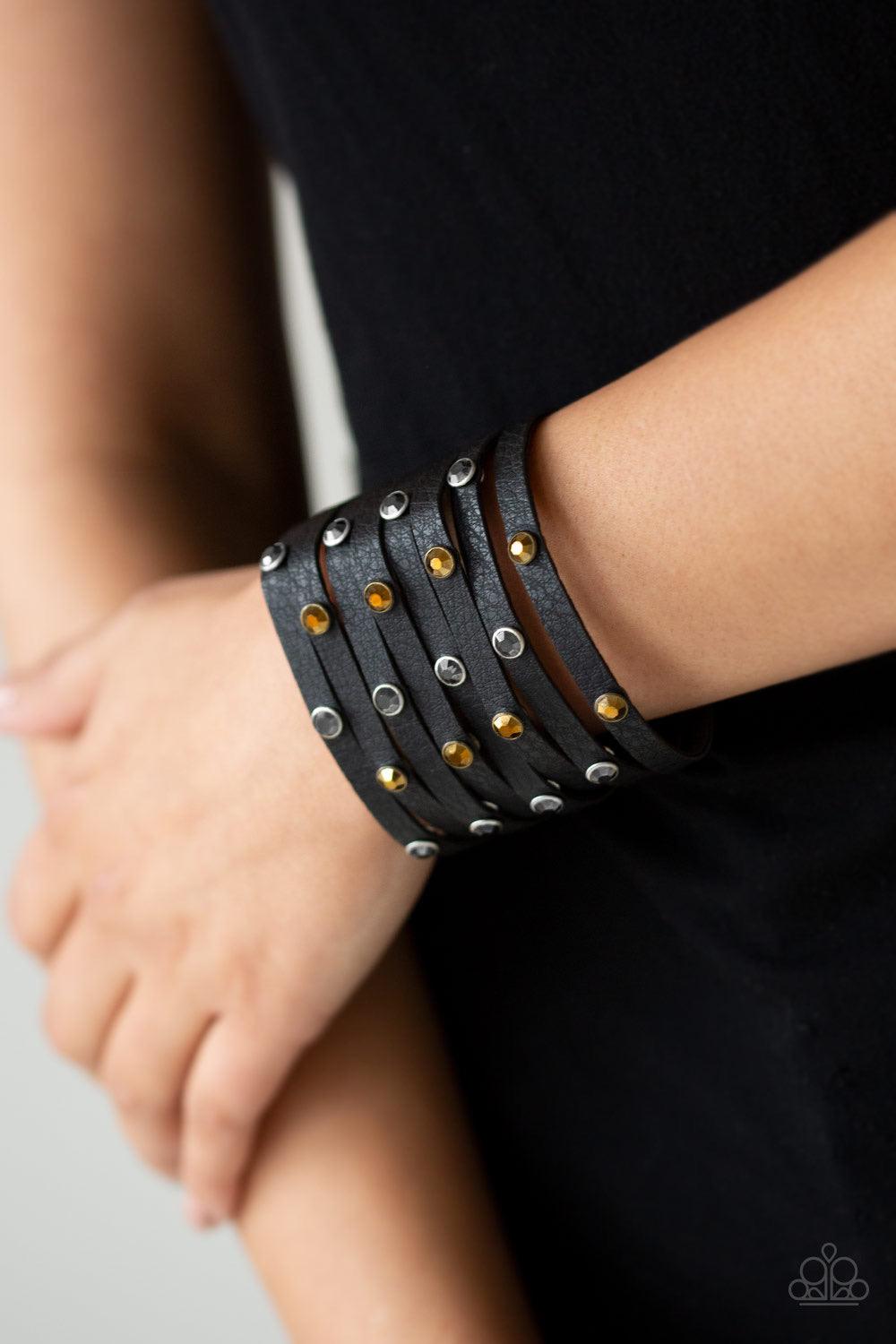 Paparazzi Accessories Go-Getter Glamorous - Black Go Getter Glamorous Black โ Paparazzi Bracelet. A thick black leather band has been spliced into eight strips across the wrist. Encased in sleek silver fittings, glittery hematite and aurum rhinestones are