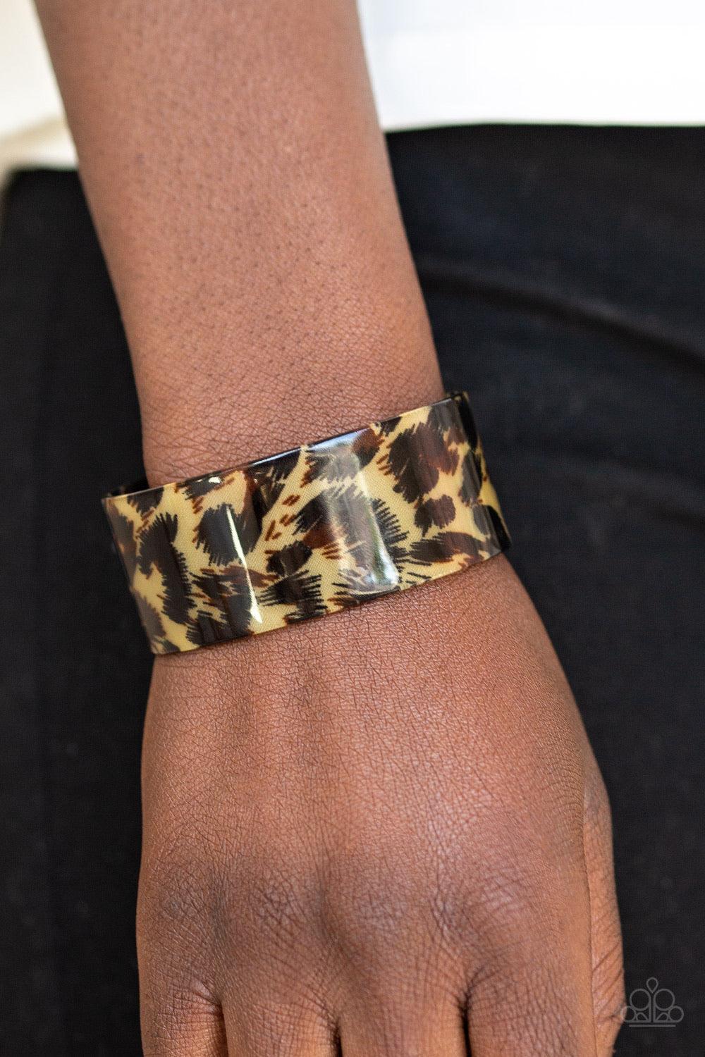 Paparazzi Accessories Where’s The Party? - Brown Featuring cheetah-like print, a thick acrylic cuff wraps around the wrist for a retro inspired look. Jewelry