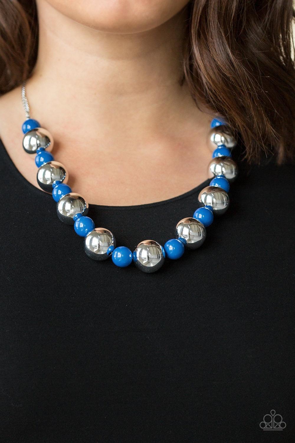 Paparazzi Accessories Top Pop - Blue Polished blue beads and dramatic silver beads drape below the collar for a perfect pop of color. Features an adjustable clasp closure. Jewelry