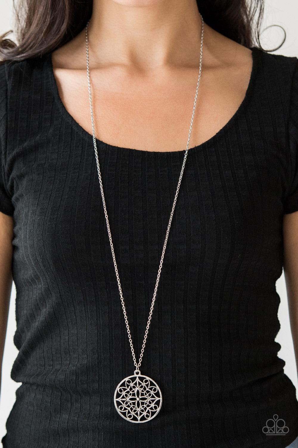 Paparazzi Accessories Mandala Melody - Silver Featuring a whimsical mandala pattern, a glistening silver pendant swings from the bottom of a lengthened silver chain for a seasonal look. Features an adjustable clasp closure. Jewelry