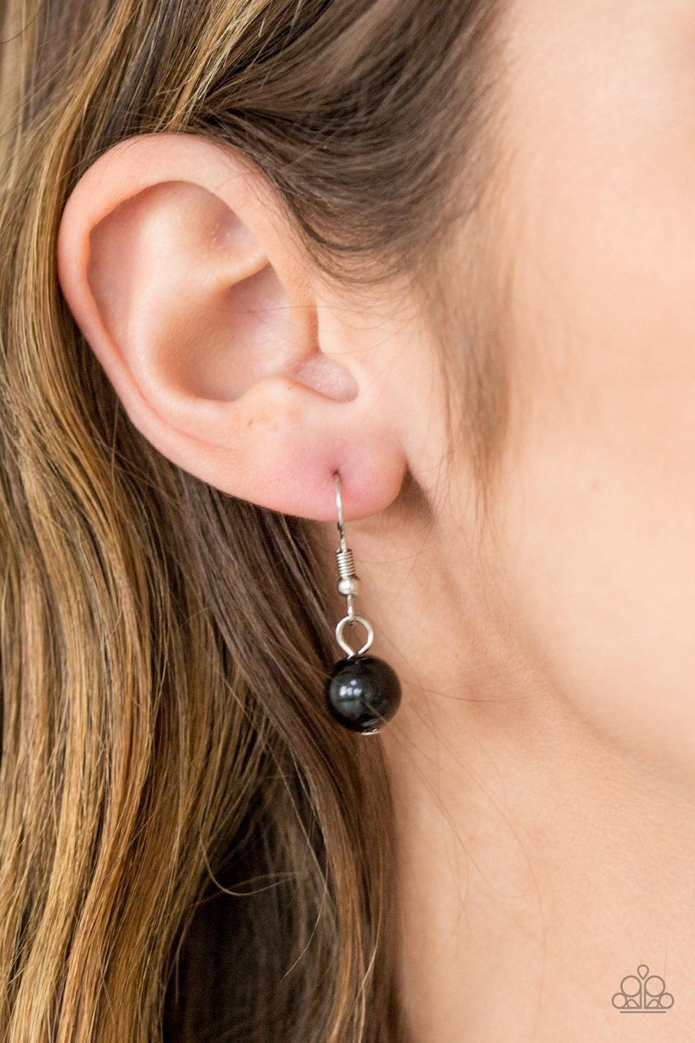Paparazzi Accessories Bean Away - Black Featuring polished and glassy finishes, black beads trickle below the collar in a refined fashion. Faceted crystal-like beads and teardrop shaped frames are sprinkled between the colorful accents for a beaming finis