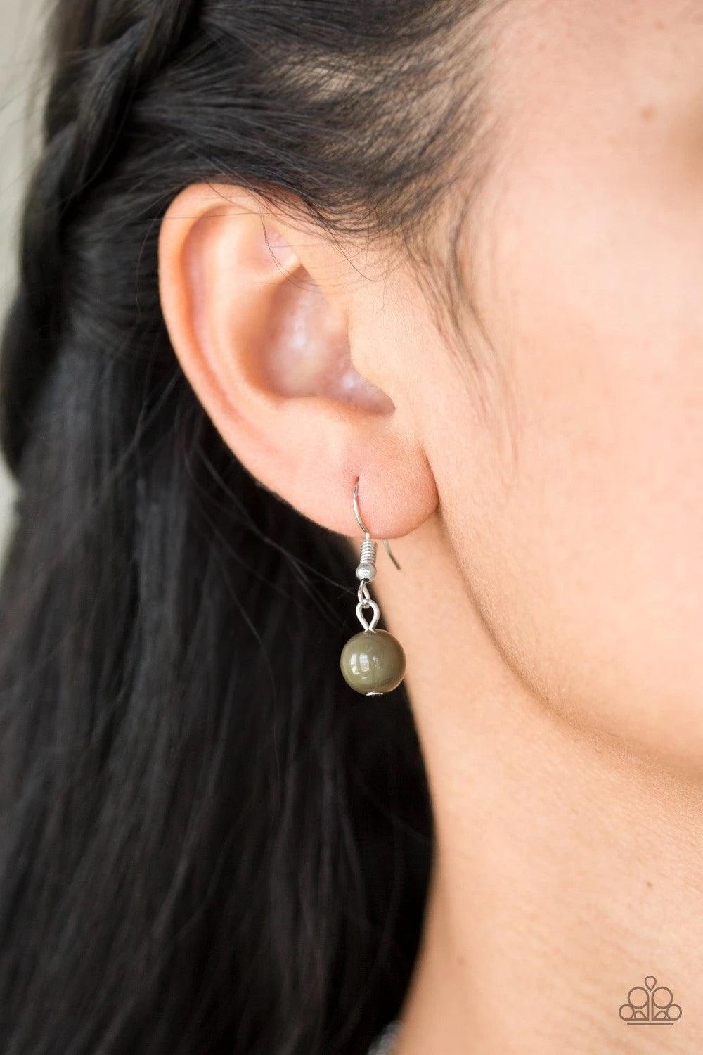 Paparazzi Accessories Sahara Sparrow - Green Featuring indigenous inspired pendants, mismatched silver chains layer down the chest for a seasonal look. Featuring earthy green beaded accents, dainty silver frames give way to a lifelike silver feather penda