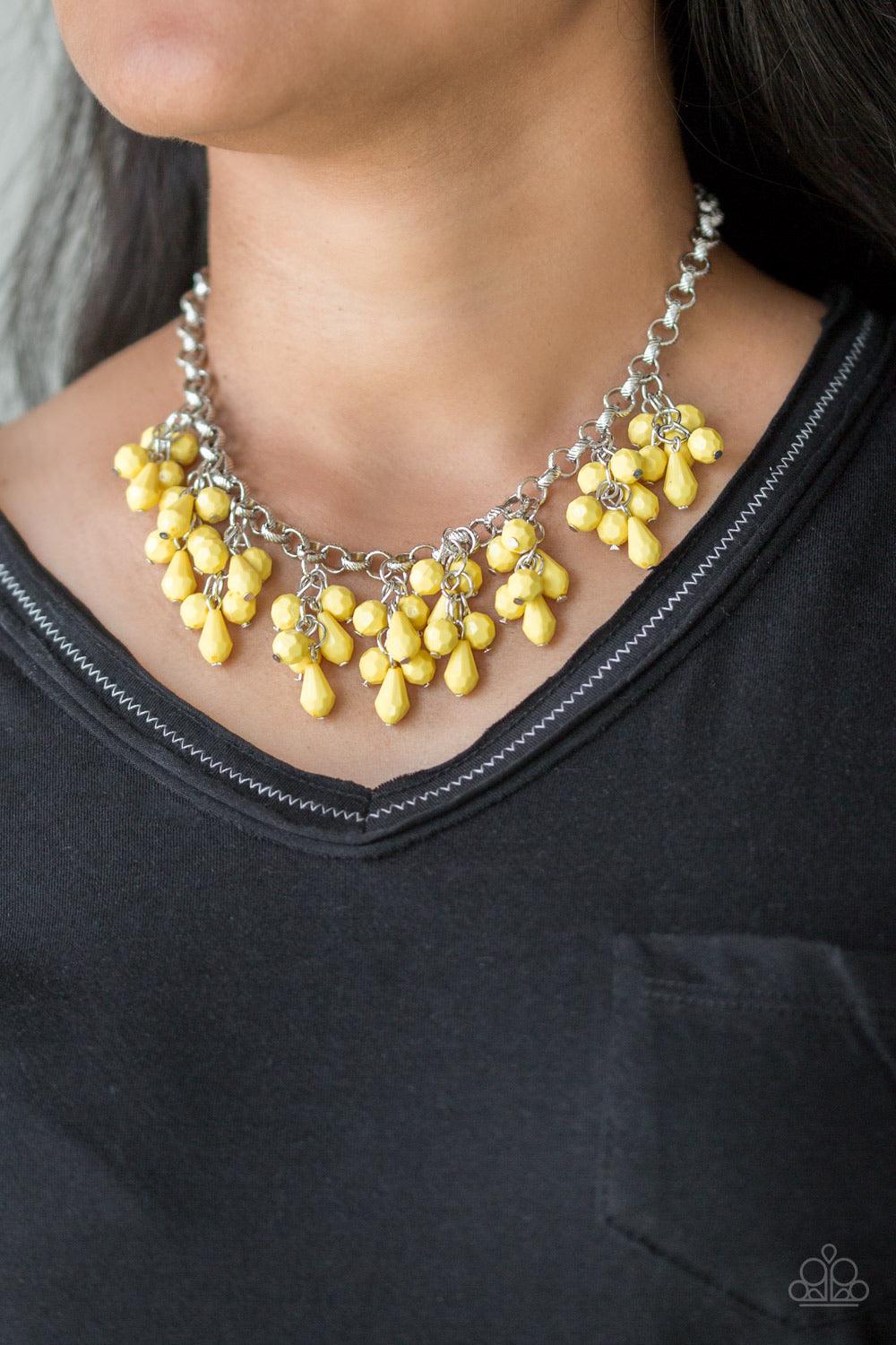 Paparazzi Accessories Modern Macarena - Yellow Featuring round and teardrop shapes, clusters of faceted yellow beads swing from the bottom of a shimmery silver chain, creating a playful fringe below the collar. Features an adjustable clasp closure. Jewelr