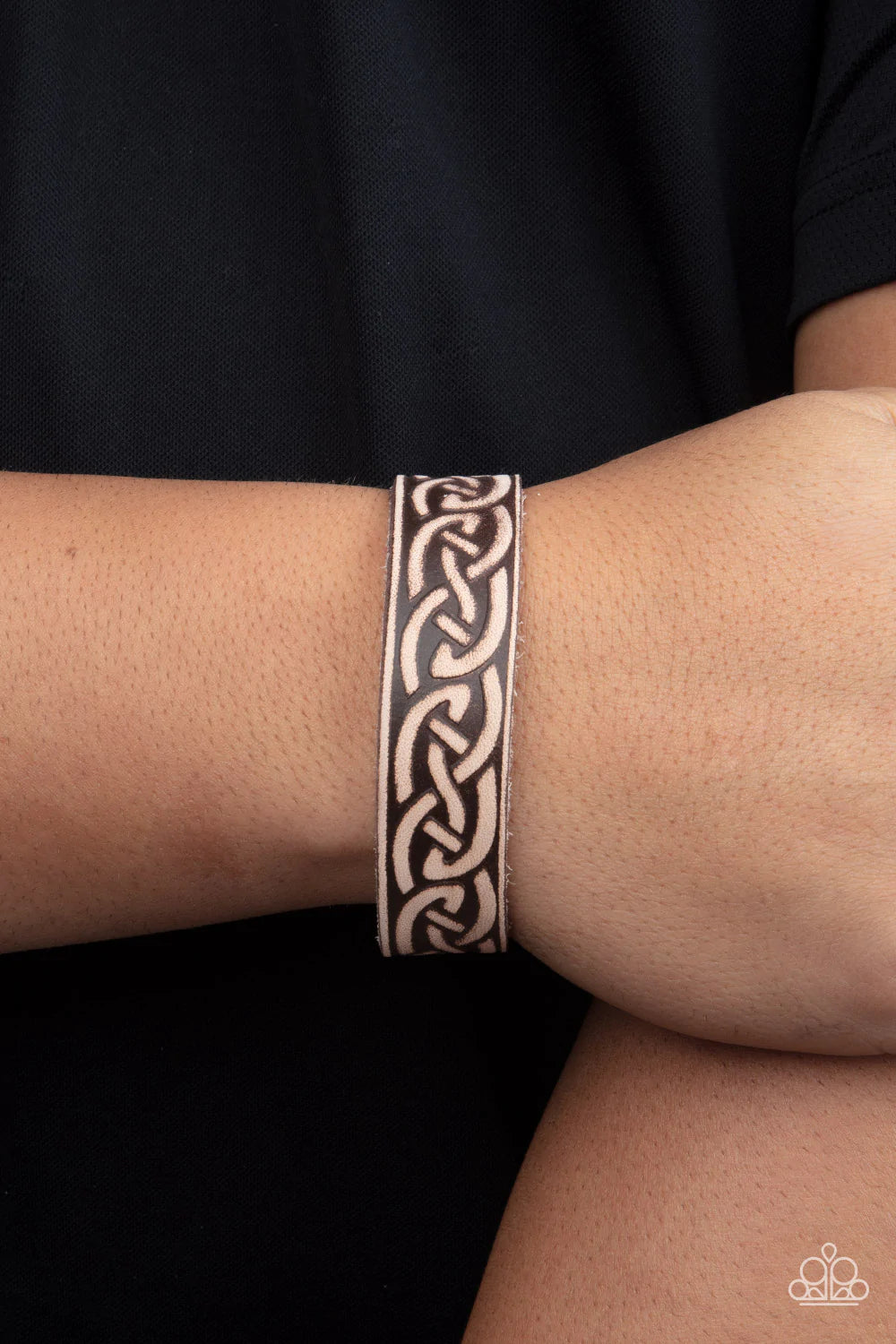 Paparazzi Accessories Rebel Runes - Brown A brown leather band is etched in a runic-like pattern, creating a rustic centerpiece around the wrist. Features an adjustable snap closure. Sold as one individual bracelet. Jewelry