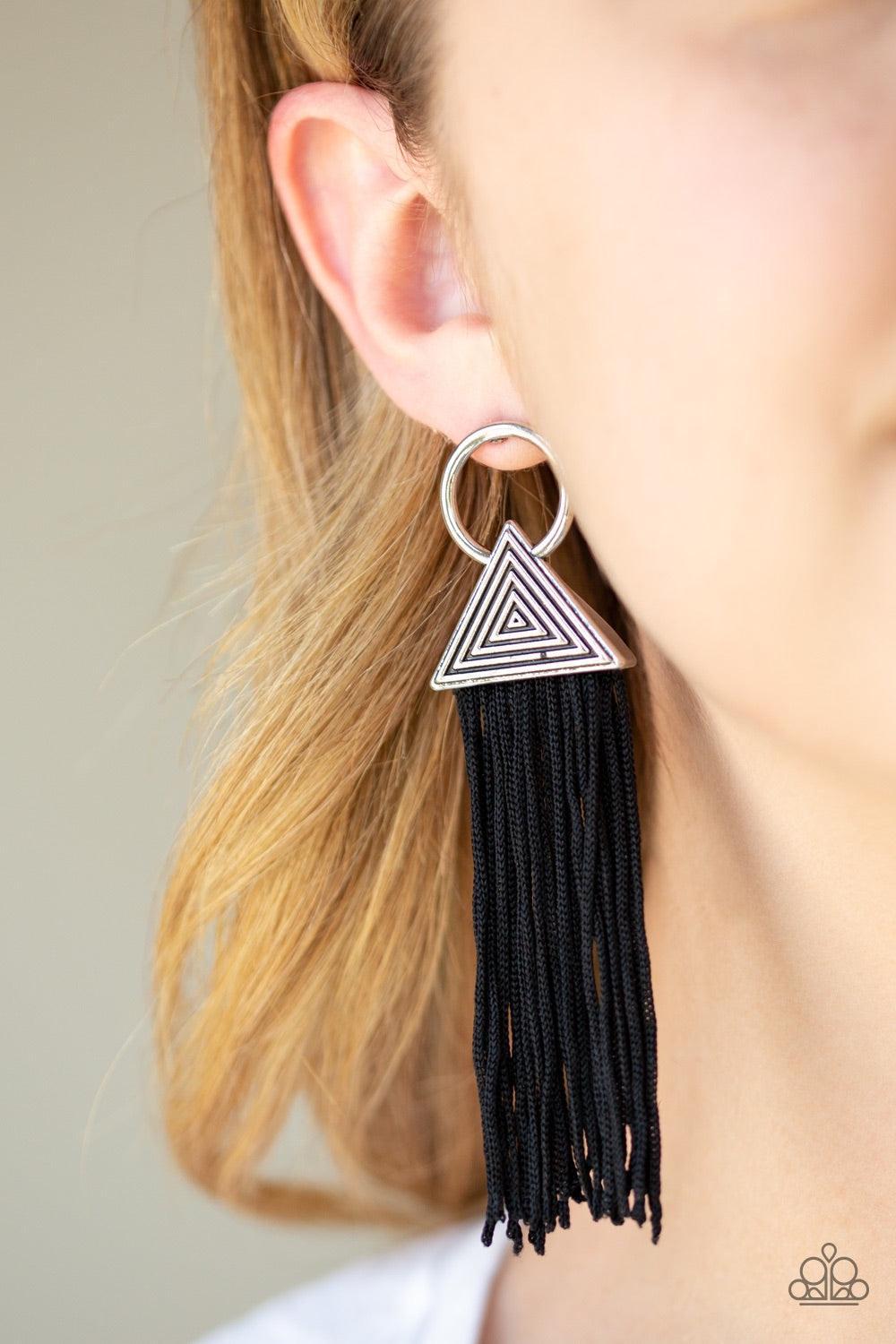 Paparazzi Accessories Oh My GIZA - Black Shiny black cording streams from the bottom of a hypnotic triangular frame attached to an airy hoop, creating a dramatically tasseled look. Earring attaches to a standard post fitting. Jewelry