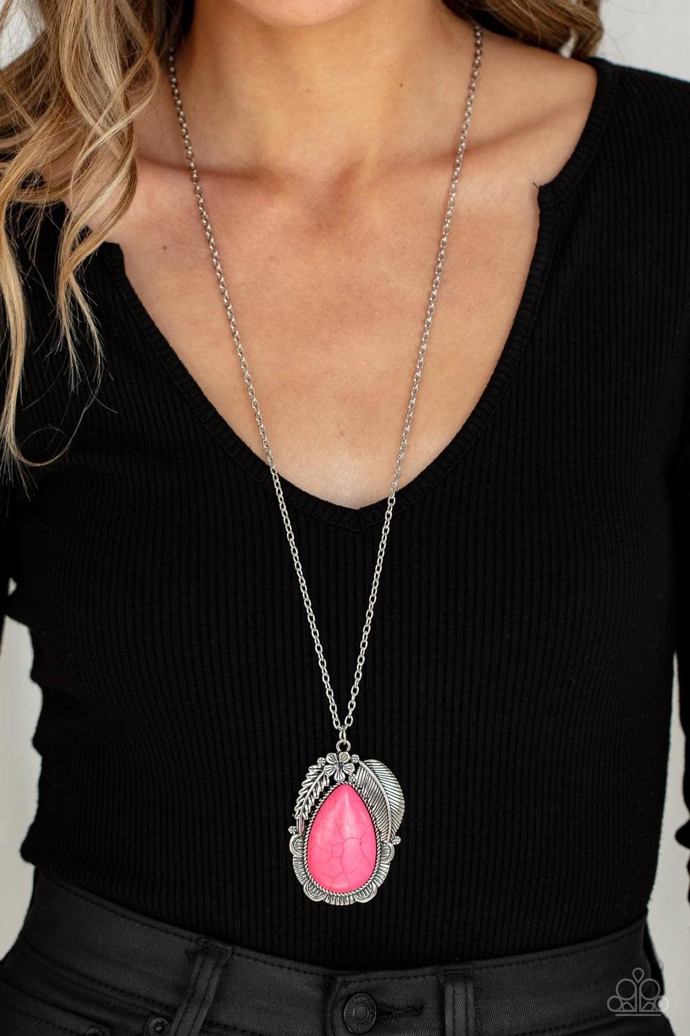 Paparazzi Accessories Tropical Mirage - Pink A silver feather, palm leaf, and dainty silver flower overlap atop an oversized pink stone teardrop that is nestled inside a textured scalloped frame, creating a dramatic pop of color at the bottom of a lengthe