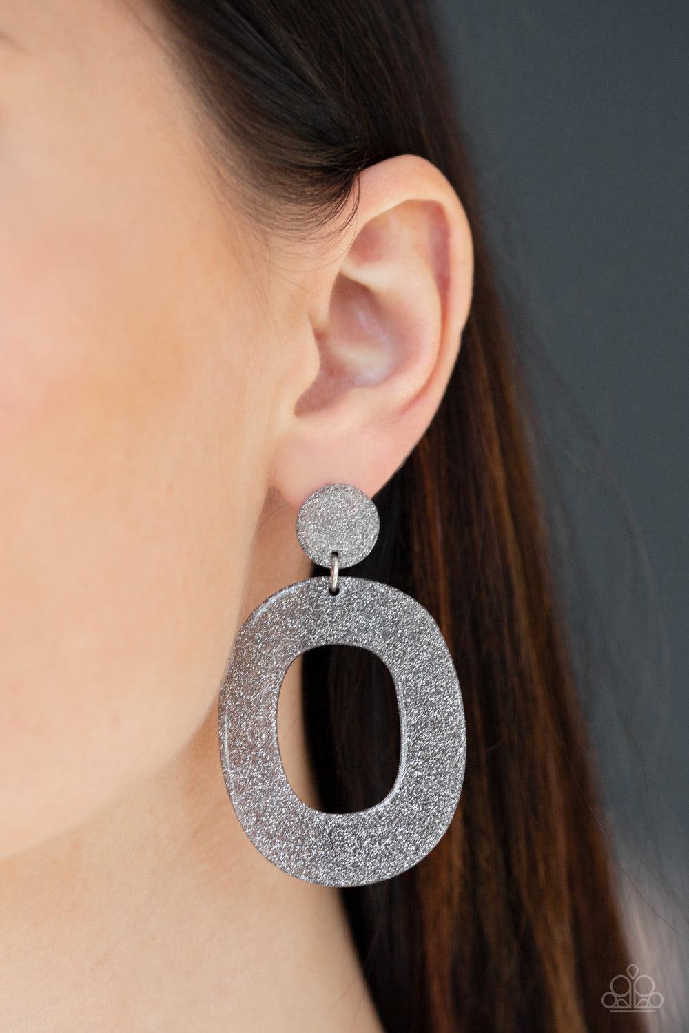 Paparazzi Accessories Miami Boulevard - Silver Brushed in a glittery finish, a large gray hoop swings from the bottom of a rounded fitting for a retro glamorous look. Earring attaches to a standard post fitting. Sold as one pair of post earrings. Jewelry