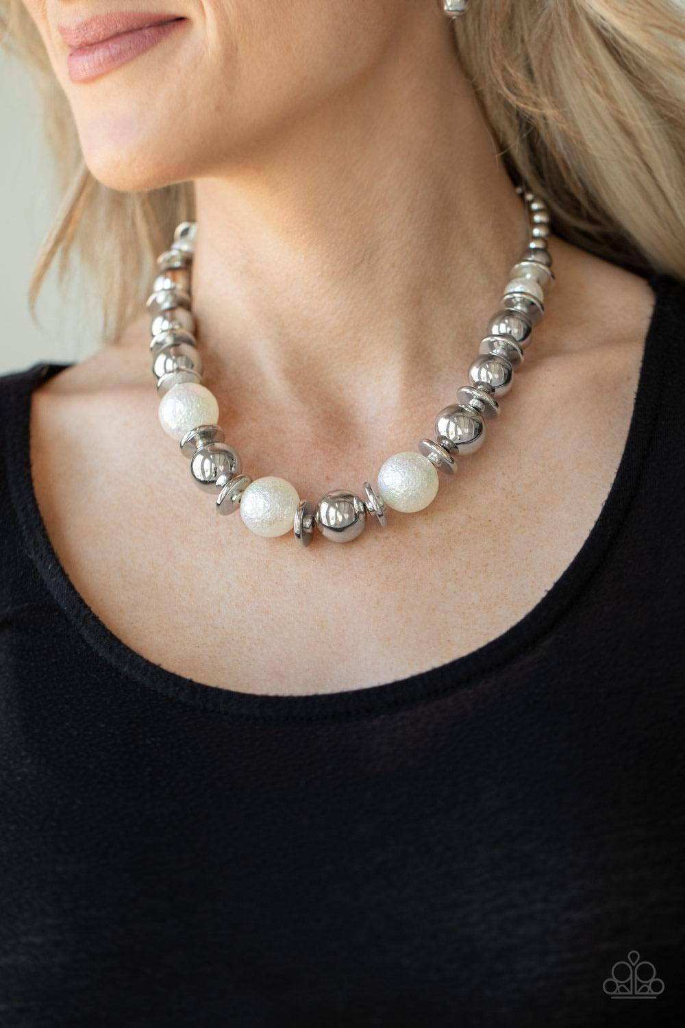 Paparazzi Accessories Twinkle Twinkle, I’m The Star ~White Brushed in a stellar iridescence, hammered pearly beads, classic silver beads, and silver discs gradually increase in size as they join below the collar for a glamorous look. Features an adjustabl