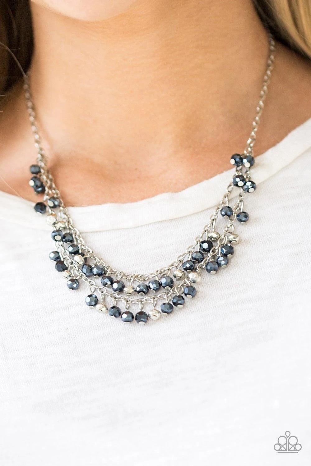 Paparazzi Accessories So In Season - Blue Metallic blue gems and faceted silver beads dangle from two rows of silver chains, creating a glamorous fringe below the collar. Features an adjustable clasp closure. Sold as one individual necklace. Includes one