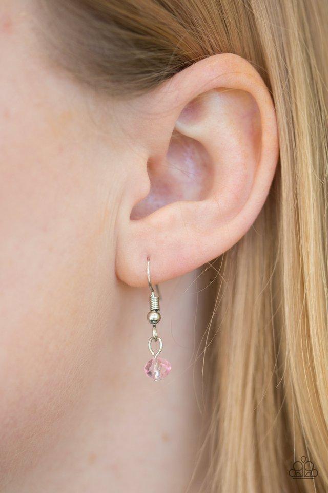 Paparazzi Accessories Diva Deluxe - Pink Dainty white pearls alternate with pink crystal-like beading along a silver chain. An extension of pearls and crystal beading cascades from the chain, giving way to a dramatic teardrop pendant for a vintage inspire