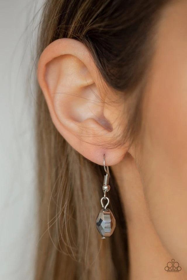 Paparazzi Accessories Duchess Dazzle - Silver A collection of hematite rhinestone gems and abstract silver rings trickle along a classic silver chain across the chest for a refined flair. Features an adjustable clasp closure. Sold as one individual neckla